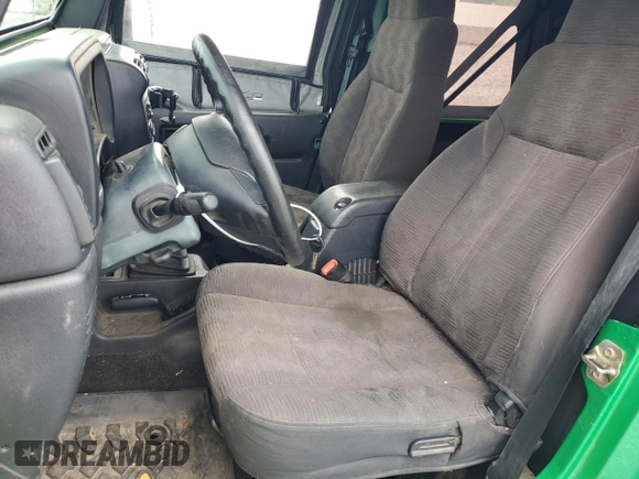 2004 Jeep Wrangler SE with VIN 1J4FA29124P769475, listed as a Copart auction lot 64371244 with 136,877 mi miles and Salvage title. Bid and sale history available at DreamBid. Image 7.