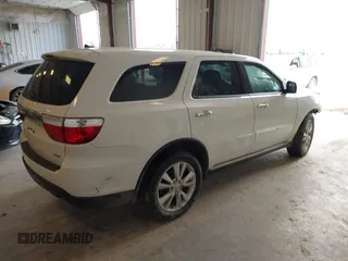 2013 Dodge Durango Crew z VIN 1C4SDJDT3DC540700, wystawiony jako IAAI lot #42097270 z przebiegiem 197 195 mil mil oraz . Historia ofert i sprzedaży dostępna na DreamBid. Obrazek 4.
