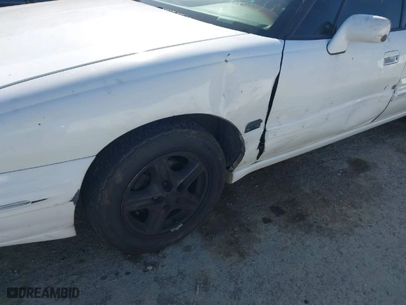 1999 Pontiac Bonneville SE with VIN 1G2HX52KXXH254051, listed as a IAAI auction lot 41990245 with 213,000 mi miles. Bid and sale history available at carsss.com. Image 6.