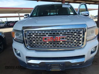 2018 GMC Canyon 4WD Denali z VIN 1GTP6EE11J1178961, wystawiony jako IAAI lot #42499884 z przebiegiem 71 309 mil mil oraz . Historia ofert i sprzedaży dostępna na DreamBid. Obrazek 6.
