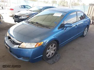2010 Honda Civic Sdn LX with VIN 2HGFA1F50AH581076, listed as a IAAI auction lot 41945819 with 154,636 mi miles. Bid and sale history available at carsss.com. Image 2.
