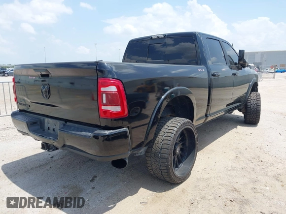 2021 Ram 2500 Laramie with VIN 3C6UR5FL7MG621346, listed as a IAAI auction lot 42419962 with 96,647 mi miles and . Bid and sale history available at DreamBid. Image 4.