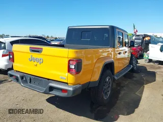 2021 Jeep Gladiator Overland z VIN 1C6HJTFG3ML552660, wystawiony jako IAAI lot #41636232 z przebiegiem 37 769 mil mil oraz . Historia ofert i sprzedaży dostępna na DreamBid. Obrazek 4.