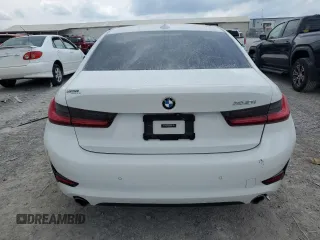 2020 BMW 3 Series 330i with VIN 3MW5R1J01L8B13902, listed as a Copart auction lot 59869625 with 54,992 mi miles and Salvage title. Bid and sale history available at DreamBid. Image 6.