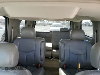 2005 GMC Yukon SLE with VIN 1GKEC13T15J230550, listed as a Copart auction lot 77214624 with 203,095 mi miles and Salvage Title. Bid and sale history available at carsss.com. Image 10.