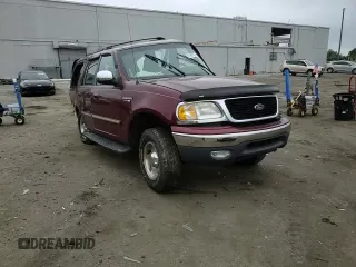 1999 Ford Expedition XLT with VIN 1FMPU18L6XLA61106, listed as a Copart auction lot 62688735 with 105,551 mi miles and Salvage title. Bid and sale history available at DreamBid. Image 14.