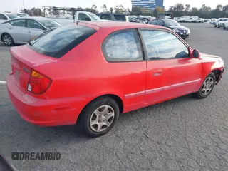 2003 Hyundai Accent GL with VIN KMHCG35C23U238969, listed as a IAAI auction lot 41462884 with 156,682 mi miles. Bid and sale history available at carsss.com. Image 4.