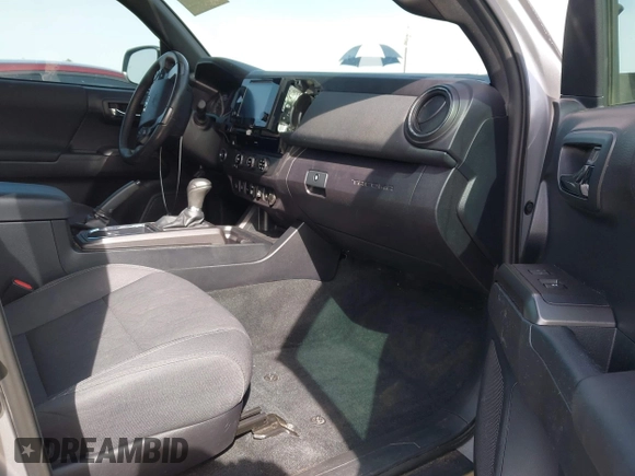 2018 Toyota Tacoma SR5 with VIN 3TMAZ5CN0JM053861, listed as a IAAI auction lot 41920377 with 104,015 mi miles and . Bid and sale history available at DreamBid. Image 5.
