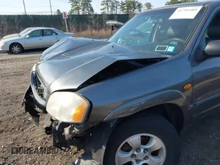 2004 Mazda Tribute LX with VIN 4F2CZ941X4KM19302, listed as a IAAI auction lot 41791389 with 123,036 mi miles. Bid and sale history available at carsss.com. Image 13.