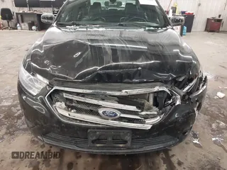 2014 Ford Taurus SEL with VIN 1FAHP2E87EG117653, listed as a IAAI auction lot 41589415 with 125,040 mi miles. Bid and sale history available at carsss.com. Image 6.