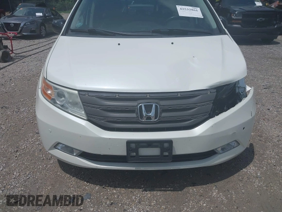 2013 Honda Odyssey Touring with VIN 5FNRL5H9XDB049390, listed as a IAAI auction lot 42532861 with 129,376 mi miles and . Bid and sale history available at DreamBid. Image 18.