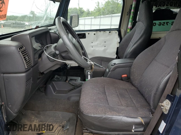 2001 Jeep Wrangler Sport with VIN 1J4FA49S01P363856, listed as a Copart auction lot 62494785 with 154,782 mi miles and Salvage title. Bid and sale history available at DreamBid. Image 7.