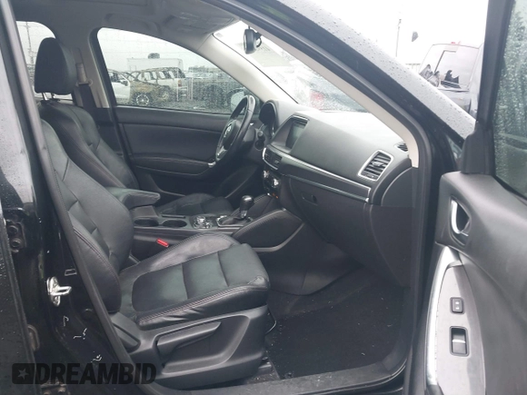 2016 Mazda CX-5 Grand Touring z VIN JM3KE4DY5G0742686, wystawiony jako IAAI lot #41598719 z przebiegiem 117 643 mil mil oraz . Historia ofert i sprzedaży dostępna na DreamBid. Obrazek 5.
