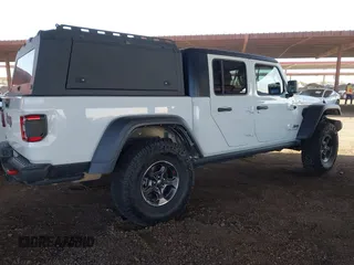 2022 Jeep Gladiator Rubicon with VIN 1C6JJTBM6NL145009, listed as a IAAI auction lot 42134143 with 59,438 mi miles and . Bid and sale history available at DreamBid. Image 4.