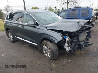 2019 Hyundai Santa Fe SEL z VIN 5NMS3CAD4KH075239, wystawiony jako IAAI lot #42156205 z przebiegiem 63 000 mil mil oraz . Historia ofert i sprzedaży dostępna na DreamBid. Obrazek 1.