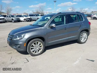 2012 Volkswagen Tiguan SE w/Sunroof & Nav with VIN WVGBV7AX4CW000207, listed as a IAAI auction lot 41889815 with 138,669 mi miles. Bid and sale history available at carsss.com. Image 2.
