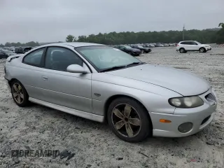 2004 Pontiac GTO z VIN 6G2VX12G74L183006, wystawiony jako Copart lot #58619105 z przebiegiem 281 390 mil mil oraz Tytuł czysty. Historia ofert i sprzedaży dostępna na DreamBid. Obrazek 4.