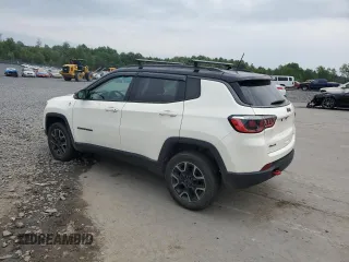 2019 Jeep Compass Trailhawk with VIN 3C4NJDDB5KT671613, listed as a Copart auction lot 61023125 with 64,793 mi miles and Salvage title. Bid and sale history available at DreamBid. Image 2.