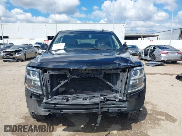 2015 Chevrolet Tahoe LT with VIN 1GNSCBKCXFR214072, listed as a IAAI auction lot 40512435 with 98,955 mi miles and . Bid and sale history available at DreamBid. Image 13.