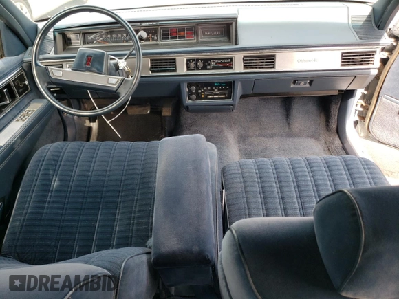 1989 Oldsmobile Delta z VIN 1G3HN54C8KH301125, wystawiony jako Copart lot #70709764 z przebiegiem 87 068 mil mil oraz Tytuł czysty. Historia ofert i sprzedaży dostępna na DreamBid. Obrazek 8.