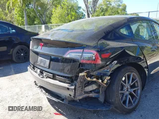 2023 Tesla Model 3 with VIN 5YJ3E1EAXPF623403, listed as a IAAI auction lot 41829543 with 29,414 mi miles and . Bid and sale history available at carsss.com. Image 6.