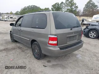 2005 Kia Sedona LX with VIN KNDUP132056674430, listed as a IAAI auction lot 41553321 with 136,734 mi miles. Bid and sale history available at carsss.com. Image 3.
