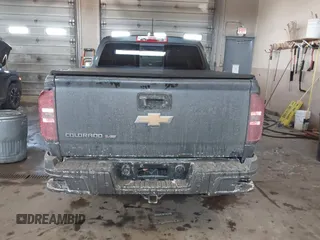 2019 Chevrolet Colorado 4WD Z71 z VIN 1GCGTDEN9K1299292, wystawiony jako IAAI lot #41626944 z przebiegiem 84 949 mil mil oraz . Historia ofert i sprzedaży dostępna na DreamBid. Obrazek 16.