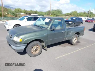 2002 Mazda B-Series 2WD Truck SX with VIN 4F4YR12D32TM21251, listed as a IAAI auction lot 41273974 with 155,165 mi miles. Bid and sale history available at carsss.com. Image 2.