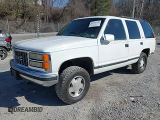 1999 GMC Yukon with VIN 1GKEK13R8XJ763098, listed as a IAAI auction lot 41753745 with 209,451 mi miles. Bid and sale history available at carsss.com. Image 2.