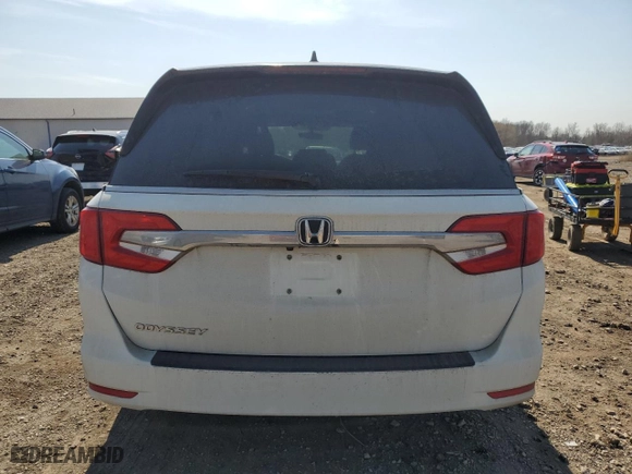 2019 Honda Odyssey EX-L with VIN 5FNRL6H71KB003335, listed as a Copart auction lot 48749535 with 130,415 mi miles and Salvage Title. Bid and sale history available at carsss.com. Image 6.