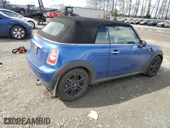 2014 MINI Convertible with VIN WMWZN3C55ET861078, listed as a Copart auction lot 50240665 with 50,541 mi miles and Salvage Title. Bid and sale history available at DreamBid. Image 3.