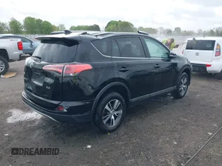 2018 Toyota RAV4 XLE with VIN 2T3WFREV9JW412755, listed as a IAAI auction lot 41889960 with 216,451 mi miles and . Bid and sale history available at carsss.com. Image 4.