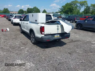 2019 Honda Ridgeline RTL-E with VIN 5FPYK3F71KB017906, listed as a IAAI auction lot 42670476 with 58,288 mi miles and . Bid and sale history available at DreamBid. Image 3.