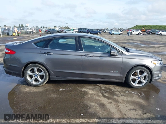 2013 Ford Fusion SE Hybrid with VIN 3FA6P0LU4DR267643, listed as a IAAI auction lot 41846681 with 148,002 mi miles. Bid and sale history available at carsss.com. Image 13.