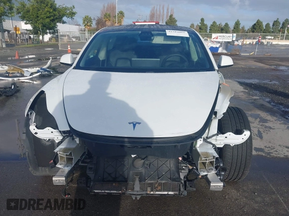 2021 Tesla Model 3 Long Range with VIN 5YJ3E1EB9MF055990, listed as a IAAI auction lot 41584065 with 49,147 mi miles and . Bid and sale history available at carsss.com. Image 13.