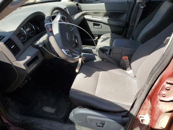 2008 Jeep Grand Cherokee Laredo with VIN 1J8GR48K68C171713, listed as a Copart auction lot 52890155 with 166,245 mi miles and Non Repairable. Bid and sale history available at carsss.com. Image 7.