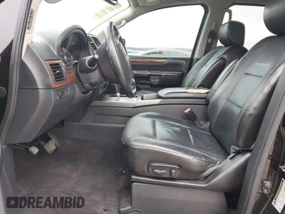 2014 Nissan Armada Platinum z VIN 5N1BA0NF5EN601168, wystawiony jako Copart lot #44590395 z przebiegiem Nie podano mil oraz Szkoda całkowita • Salvage title. Historia ofert i sprzedaży dostępna na DreamBid. Obrazek 7.
