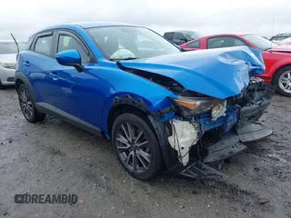 2017 Mazda CX-3 Touring z VIN JM1DKFC7XH0171860, wystawiony jako IAAI lot #42249818 z przebiegiem 54 873 mil mil oraz . Historia ofert i sprzedaży dostępna na DreamBid. Obrazek 1.