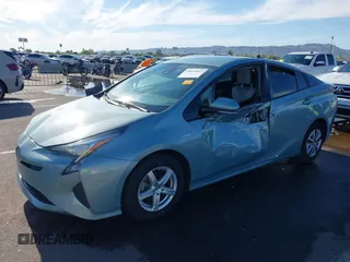 2018 Toyota Prius Two with VIN JTDKBRFUXJ3066430, listed as a IAAI auction lot 42034812 with 119,711 mi miles and . Bid and sale history available at carsss.com. Image 6.