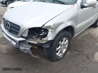 1999 Mercedes-Benz M-Class with VIN 4JGAB72E4XA113675, listed as a IAAI auction lot 41554604 with 230,092 mi miles. Bid and sale history available at carsss.com. Image 6.
