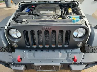 2015 Jeep Wrangler Unlimited Rubicon with VIN 1C4BJWFGXFL518301, listed as a Copart auction lot 61910775 with 153,945 mi miles and Clean title. Bid and sale history available at DreamBid. Image 12.