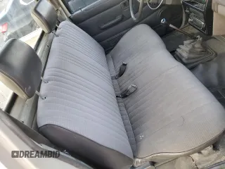 1986 Nissan Hardbody E z VIN JN6ND11S1GW037479, wystawiony jako Copart lot #81775934 z przebiegiem 389 841 mil mil oraz Szkody całkowita. Historia ofert i sprzedaży dostępna na DreamBid. Obrazek 10.