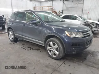 2011 Volkswagen Touareg Sport with VIN WVGFF9BP2BD000371, listed as a IAAI auction lot 41613305 with 187,641 mi miles and . Bid and sale history available at DreamBid. Image 1.
