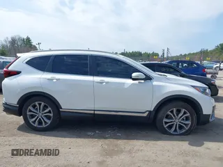 2020 Honda CR-V Touring z VIN 2HKRW2H9XLH623380, wystawiony jako IAAI lot #42039028 z przebiegiem 59 795 mil mil oraz . Historia ofert i sprzedaży dostępna na DreamBid. Obrazek 13.