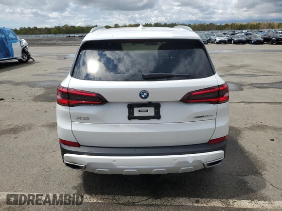 2022 BMW X5 xDrive45e with VIN 5UXTA6C03N9L84706, listed as a Copart auction lot 50725583 with 25,616 mi miles and . Bid and sale history available at DreamBid. Image 6.