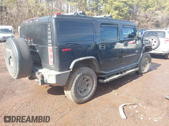 2003 Hummer H2 with VIN 5GRGN23U33H144379, listed as a IAAI auction lot 41452982 with 227,746 mi miles. Bid and sale history available at carsss.com. Image 4.