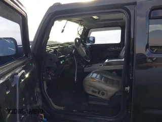 2003 Hummer H2 z VIN 5GRGN23UX3H112173, wystawiony jako IAAI lot #41093359 z przebiegiem Nie podano mil oraz . Historia ofert i sprzedaży dostępna na DreamBid. Obrazek 5.