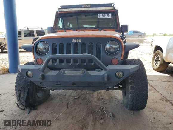 2011 Jeep Wrangler Unlimited Rubicon with VIN 1J4BA6H13BL538385, listed as a Copart auction lot 64080075 with 90,459 mi miles and Salvage title. Bid and sale history available at DreamBid. Image 5.