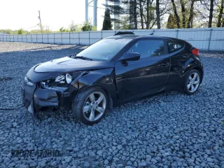 2013 Hyundai Veloster w/Black Int z VIN KMHTC6ADXDU134159, wystawiony jako Copart lot #54599035 z przebiegiem 115 668 mil mil oraz Szkoda całkowita • Salvage title. Historia ofert i sprzedaży dostępna na DreamBid. Obrazek 1.