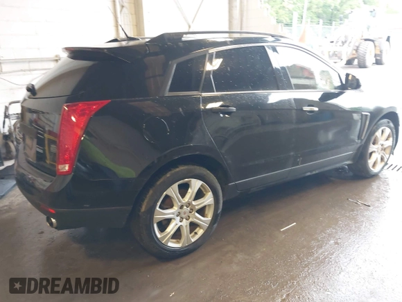 2014 Cadillac SRX Performance Collection with VIN 3GYFNFE39ES659013, listed as a IAAI auction lot 42264069 with 129,122 mi miles and . Bid and sale history available at DreamBid. Image 4.
